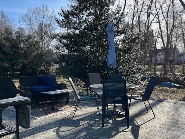 view of patio featuring outdoor dining area