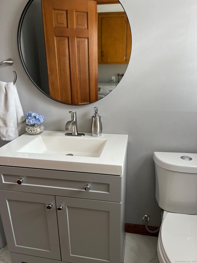 bathroom with vanity and toilet