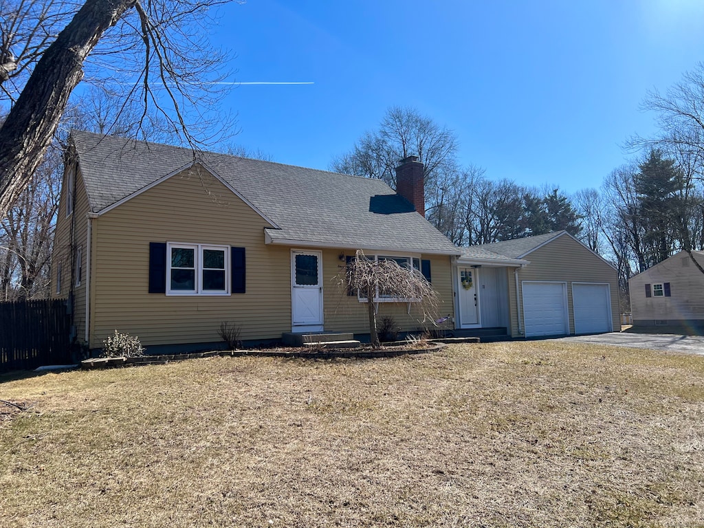 ranch-style home with driveway, roof with shingles, a chimney, entry steps, and a garage