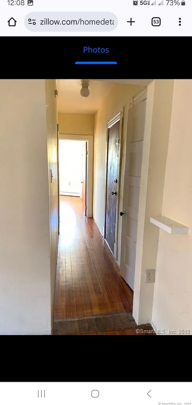 hall featuring wood finished floors