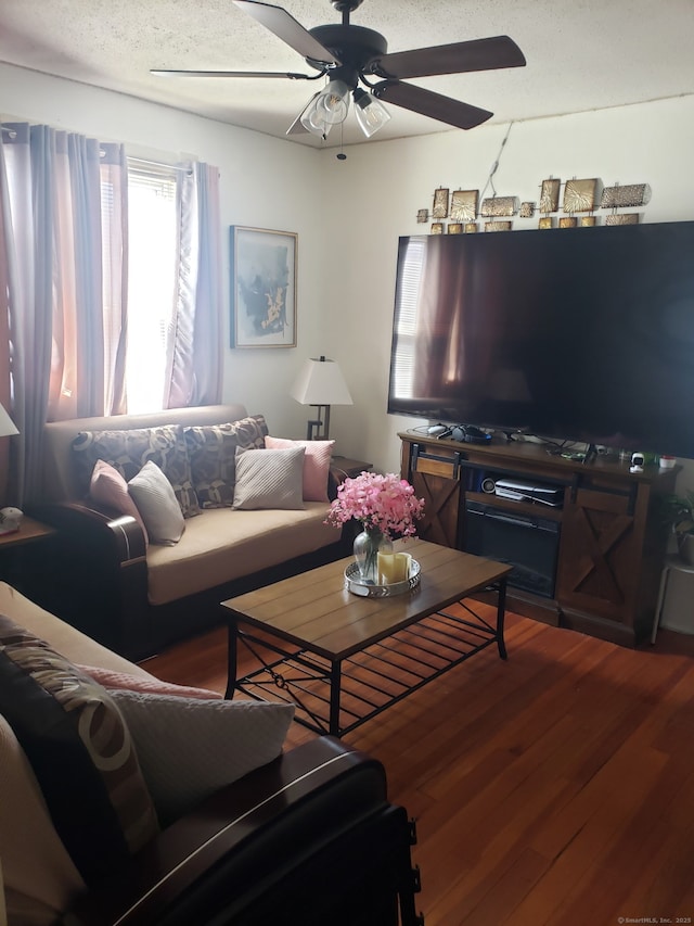 living area featuring ceiling fan and wood finished floors