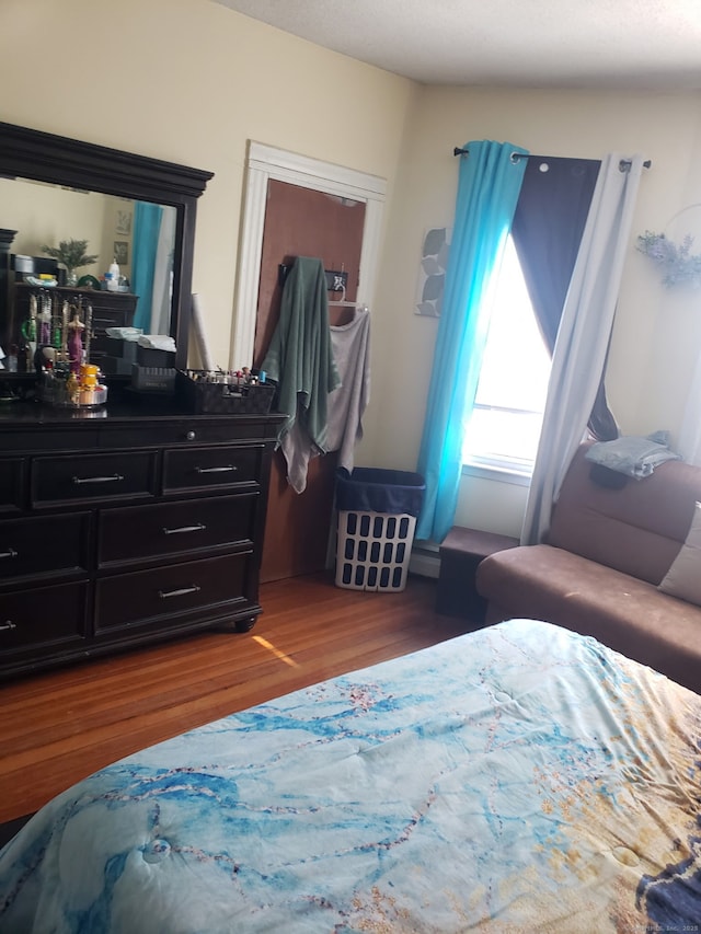 bedroom featuring wood finished floors