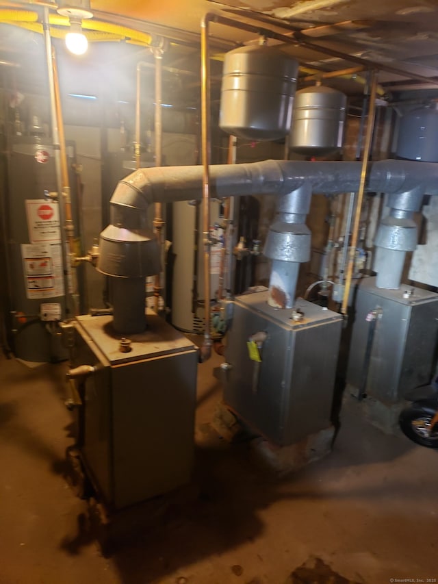 utilities featuring water heater and a heating unit