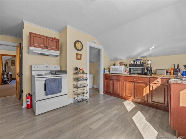 kitchen featuring under cabinet range hood, light countertops, light wood-type flooring, vaulted ceiling, and white appliances