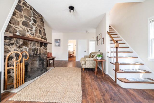 20 Musnug Rd, Danbury, CT 06811 - living room with a fireplace, dark wood-style flooring, stairs, and baseboards