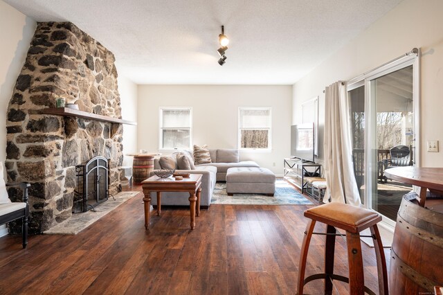 20 Musnug Rd, Danbury, CT 06811 - living area featuring wood-type flooring, a stone fireplace, and a wealth of natural light