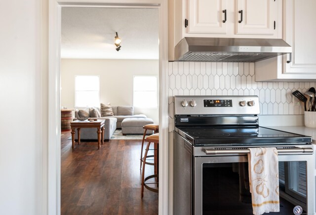 20 Musnug Rd, Danbury, CT 06811 - kitchen featuring white cabinetry, stainless steel electric stove, backsplash, wall chimney range hood, and dark wood-style floors