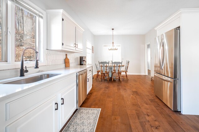 20 Musnug Rd, Danbury, CT 06811 - kitchen featuring stainless steel appliances, a sink, dark wood-type flooring, light countertops, and white cabinets