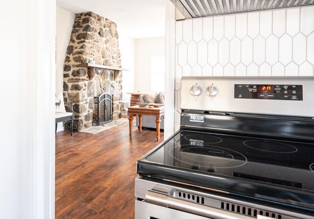 20 Musnug Rd, Danbury, CT 06811 - kitchen featuring stainless steel electric range oven, a stone fireplace, ventilation hood, and wood finished floors