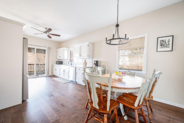 20 Musnug Rd, Danbury, CT 06811 - dining area with ceiling fan with notable chandelier, dark wood-type flooring, and baseboards