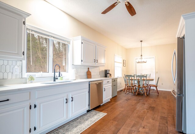 20 Musnug Rd, Danbury, CT 06811 - kitchen with white cabinetry, stainless steel appliances, a ceiling fan, and a sink