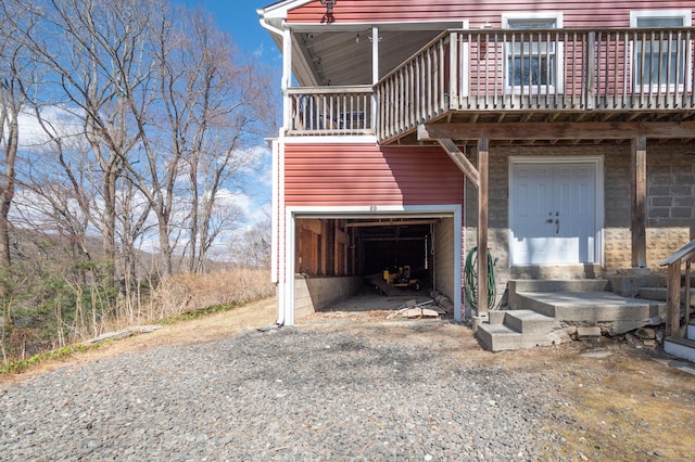 20 Musnug Rd, Danbury, CT 06811 - view of front of property featuring a deck, a garage, and gravel driveway