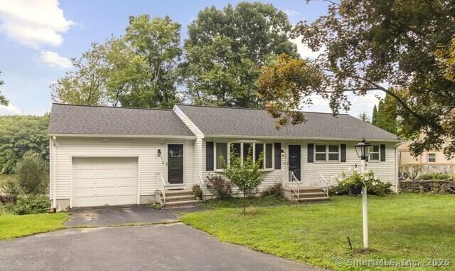 ranch-style house with aphalt driveway, a front lawn, and a garage