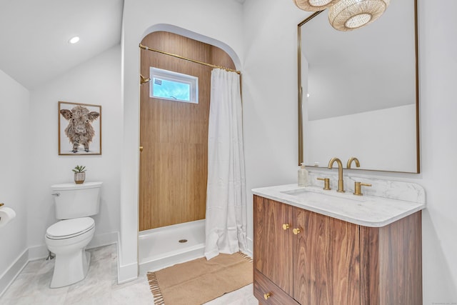 bathroom featuring a shower with curtain, toilet, baseboards, vanity, and vaulted ceiling