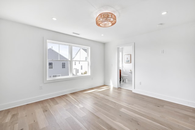 unfurnished room featuring recessed lighting, baseboards, visible vents, and light wood finished floors