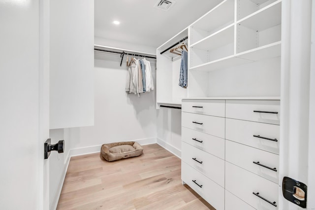 spacious closet with visible vents and light wood-type flooring