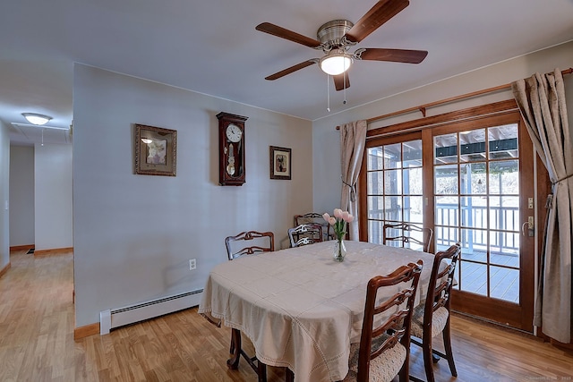 dining room with ceiling fan, baseboards, light wood-type flooring, and a baseboard radiator