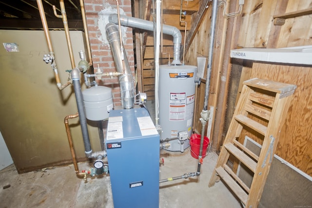 utility room featuring gas water heater