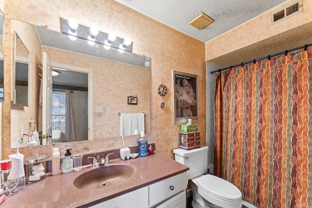 full bath with visible vents, toilet, a textured ceiling, a shower with shower curtain, and vanity