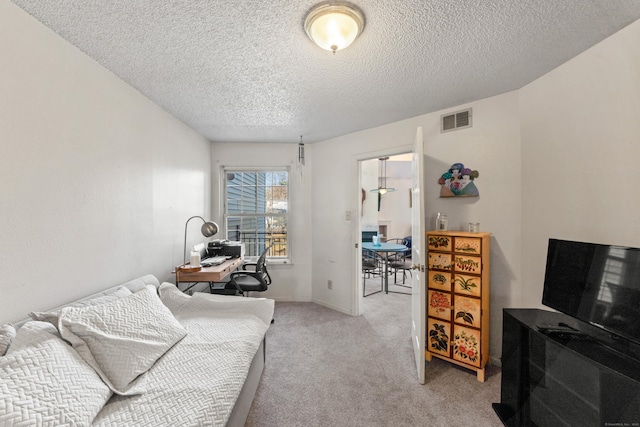 living room with a textured ceiling, baseboards, visible vents, and light carpet