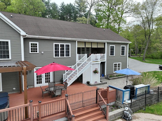 105 Mashentuck Rd, Killingly, CT 06239 - rear view of house with a deck, stairs, outdoor dining space, and roof with shingles