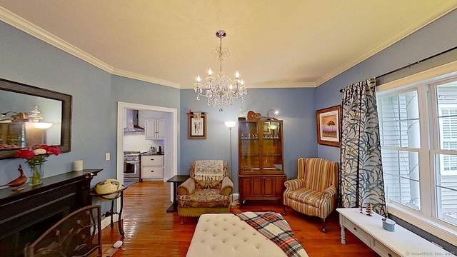 105 Mashentuck Rd, Killingly, CT 06239 - living area featuring wood finished floors, a chandelier, and ornamental molding