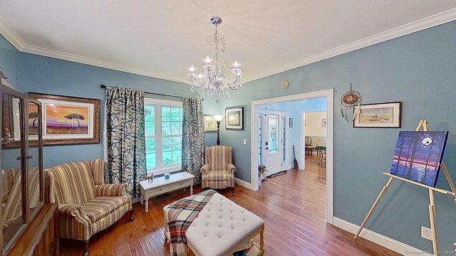 105 Mashentuck Rd, Killingly, CT 06239 - living area with a chandelier, baseboards, wood finished floors, and crown molding