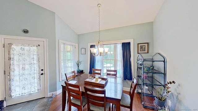 105 Mashentuck Rd, Killingly, CT 06239 - dining room featuring a chandelier, vaulted ceiling, baseboards, and wood finished floors