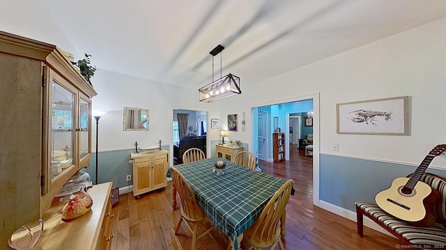 105 Mashentuck Rd, Killingly, CT 06239 - dining area with wood finished floors, a chandelier, and baseboards