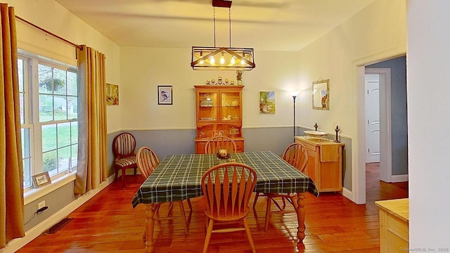 105 Mashentuck Rd, Killingly, CT 06239 - dining room with wood-type flooring, a chandelier, and baseboards