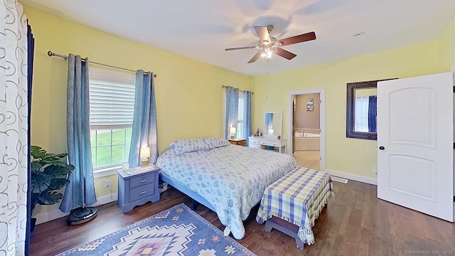105 Mashentuck Rd, Killingly, CT 06239 - bedroom with dark wood-type flooring, baseboards, a ceiling fan, and ensuite bathroom