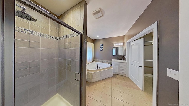 105 Mashentuck Rd, Killingly, CT 06239 - full bath featuring a stall shower, tile patterned floors, a garden tub, and vanity