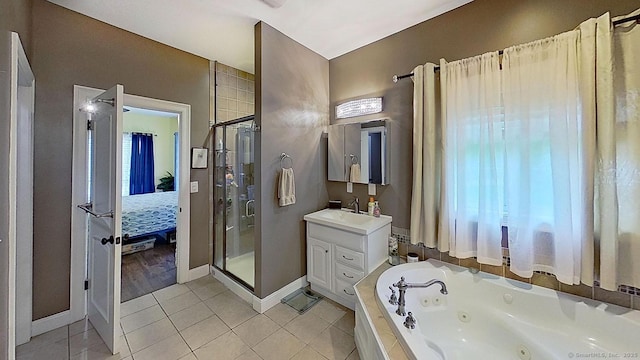 105 Mashentuck Rd, Killingly, CT 06239 - ensuite bathroom with a stall shower, tile patterned floors, baseboards, vanity, and a whirlpool tub