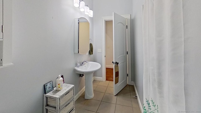 105 Mashentuck Rd, Killingly, CT 06239 - bathroom with tile patterned flooring, baseboards, and a sink