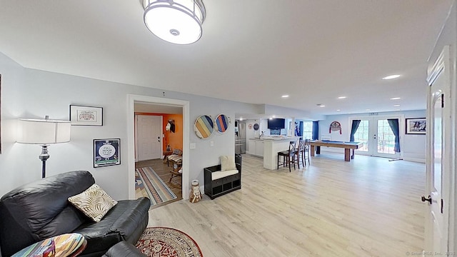 105 Mashentuck Rd, Killingly, CT 06239 - living room featuring light wood finished floors, french doors, and recessed lighting