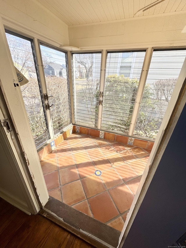 sunroom / solarium featuring wood ceiling