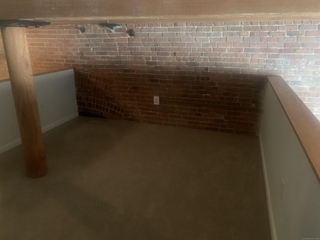 below grade area with brick wall