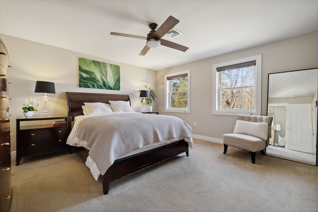 carpeted bedroom featuring a ceiling fan, baseboards, and visible vents