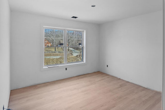 unfurnished room with light wood-style floors