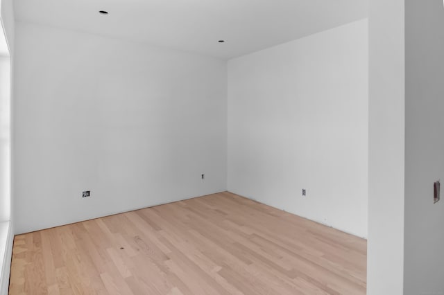 empty room with wood finished floors