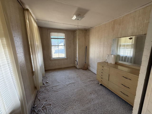 unfurnished bedroom featuring light carpet