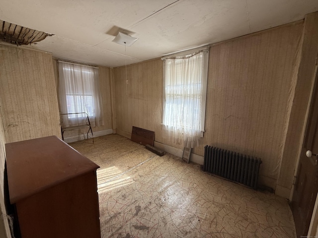 unfurnished room with radiator