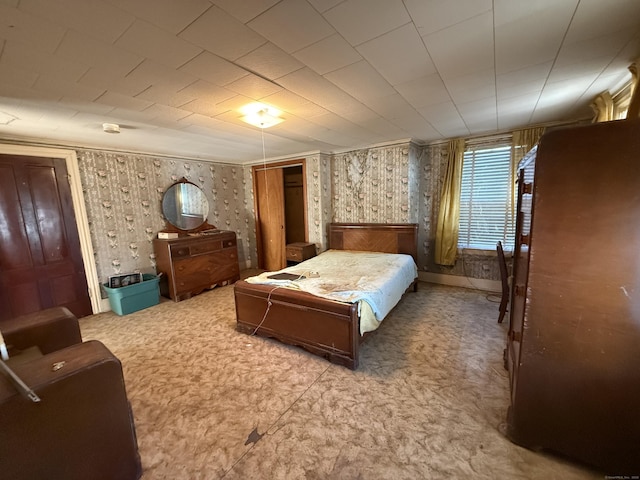 bedroom featuring wallpapered walls