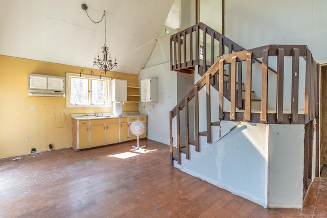 interior space with high vaulted ceiling and wood finished floors