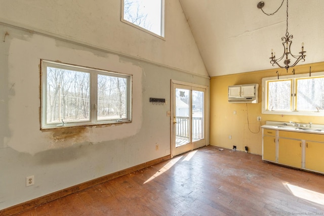 interior space featuring light wood-style flooring, plenty of natural light, and a sink