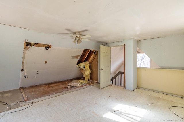 bonus room with tile patterned floors, a ceiling fan, and vaulted ceiling