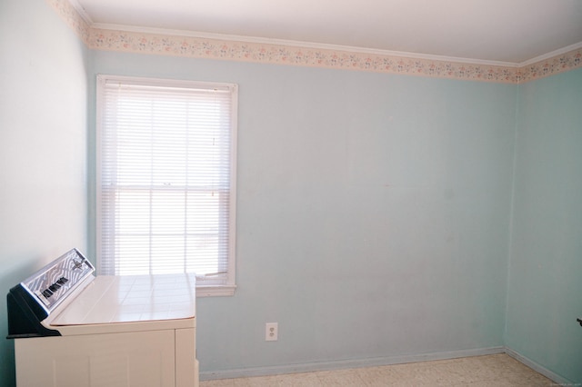 laundry area featuring baseboards and ornamental molding