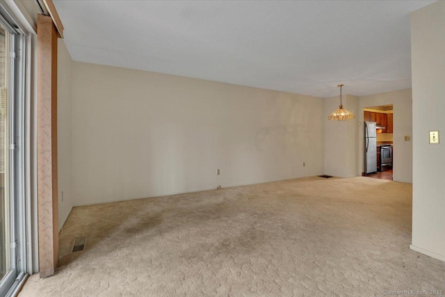 827 Oronoke Rd Apt 2-11, Waterbury, CT 06708 - interior space featuring visible vents, carpet floors, and an inviting chandelier