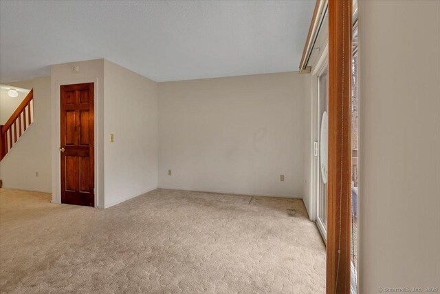 827 Oronoke Rd Apt 2-11, Waterbury, CT 06708 - carpeted empty room with stairway