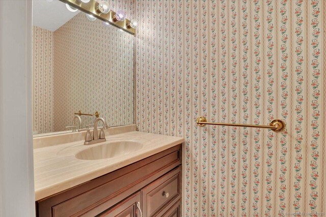 827 Oronoke Rd Apt 2-11, Waterbury, CT 06708 - bathroom featuring vanity and wallpapered walls